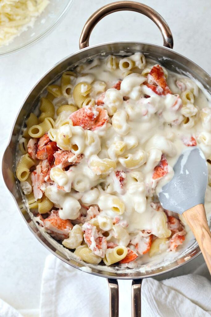 Savory shrimp and creamy pasta adorned with pico de gallo.