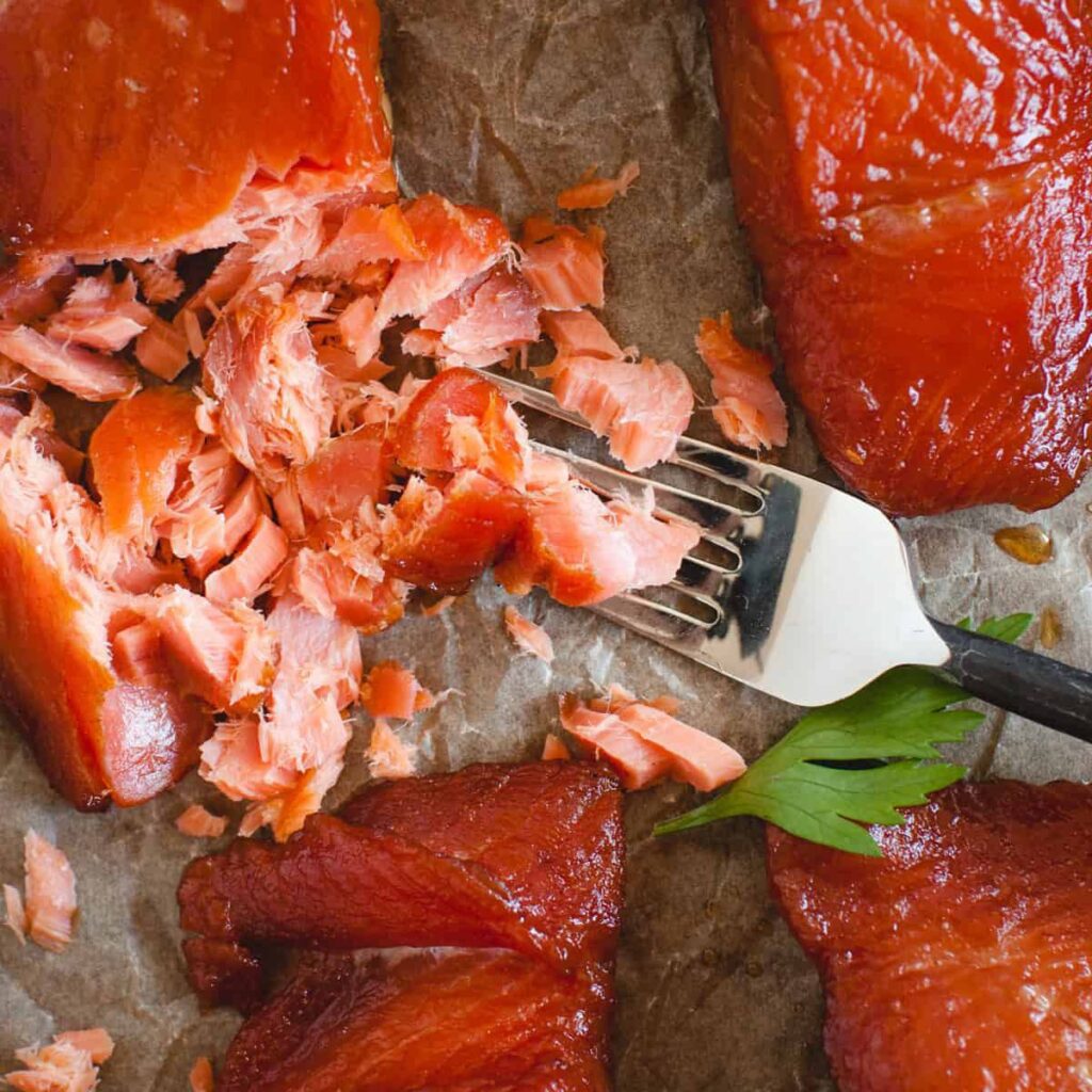 Enjoying the salmon recipe with fork.